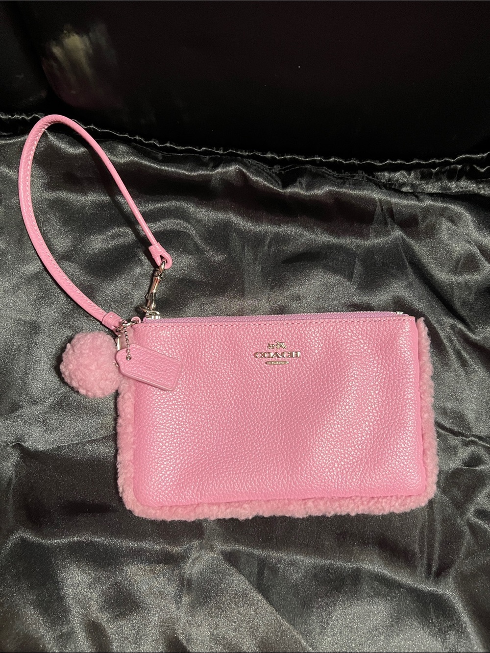 Coach Pink Pebbled Leather Wristlet with Pom Charm